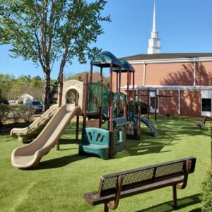 Awesome Church Playground with artificial turf and play equipment